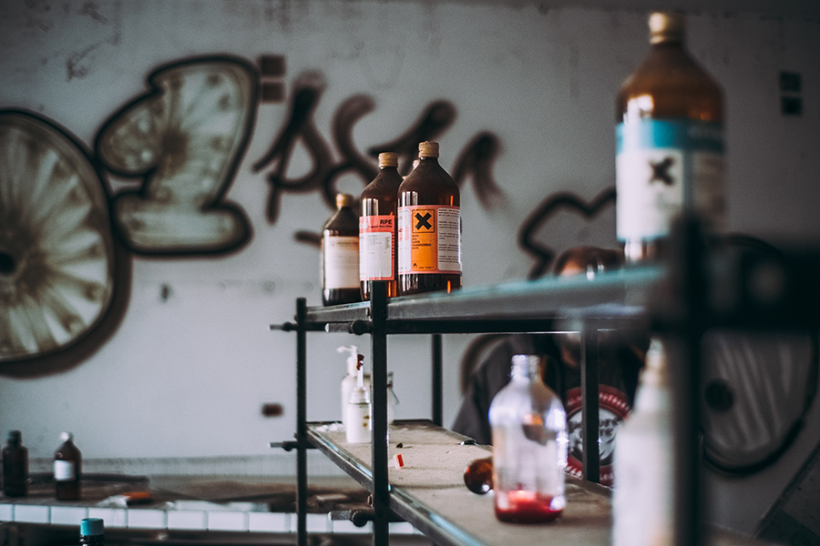 Labelled chemical bottles on a shelf