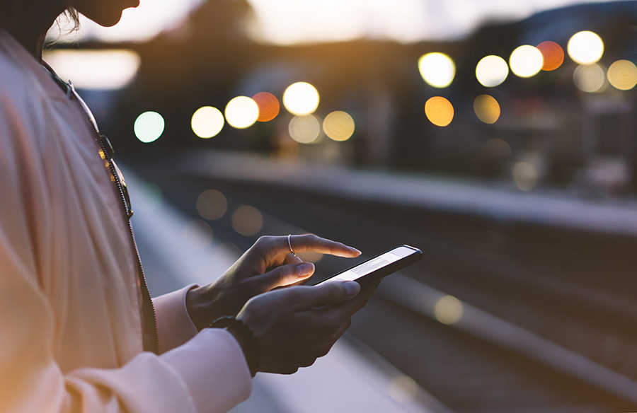 Young person on phone screen