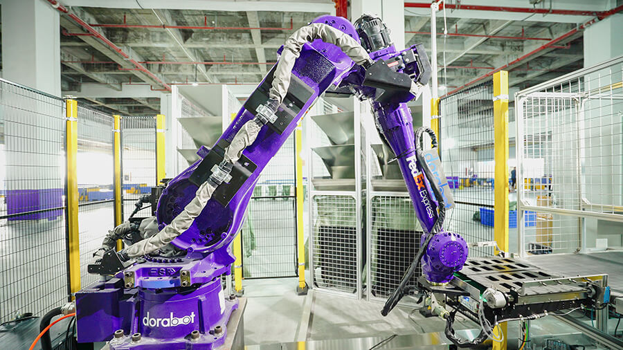 Purple robotic arm robot sorting packages