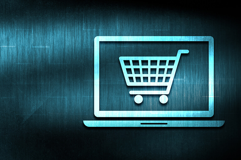Tech-driven e-commerce platforms, shopping cart icon on laptop