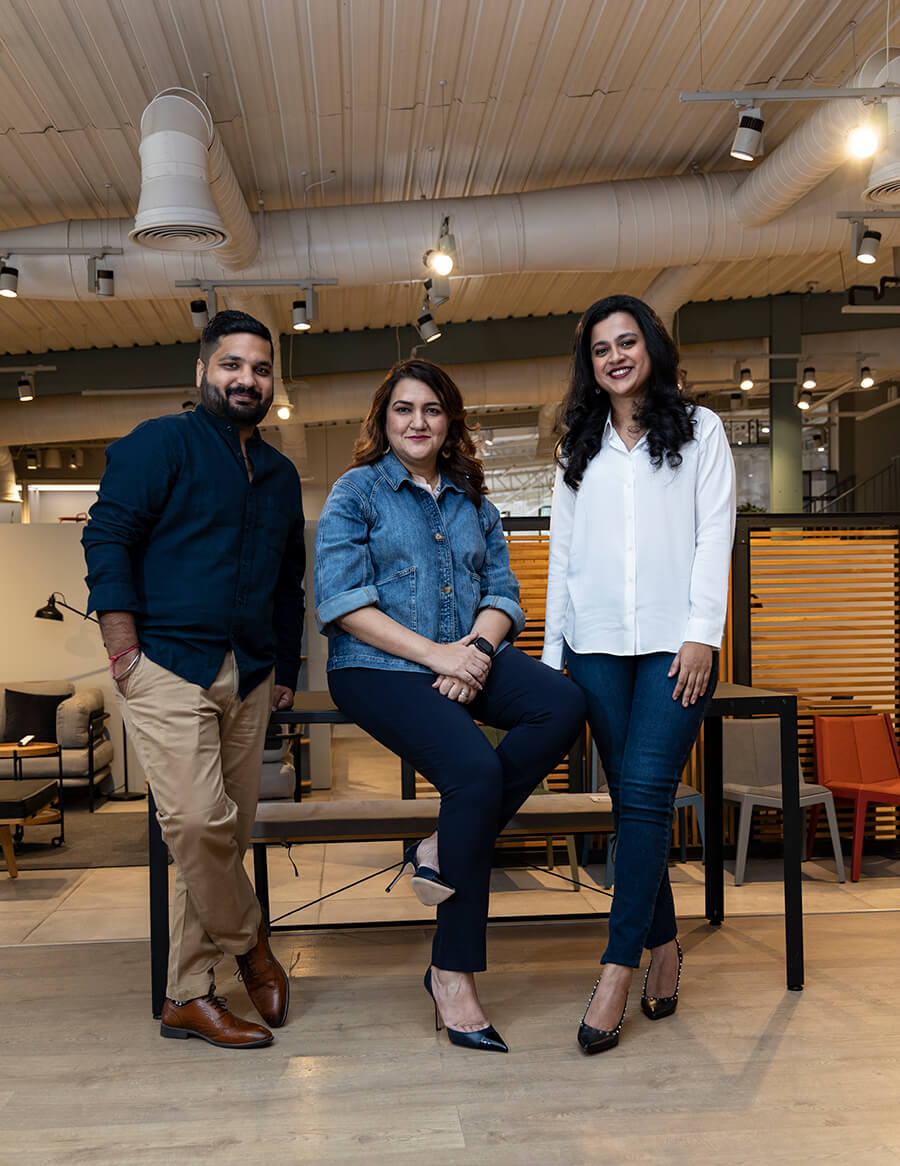 One male and two female Indian colleagues grouped