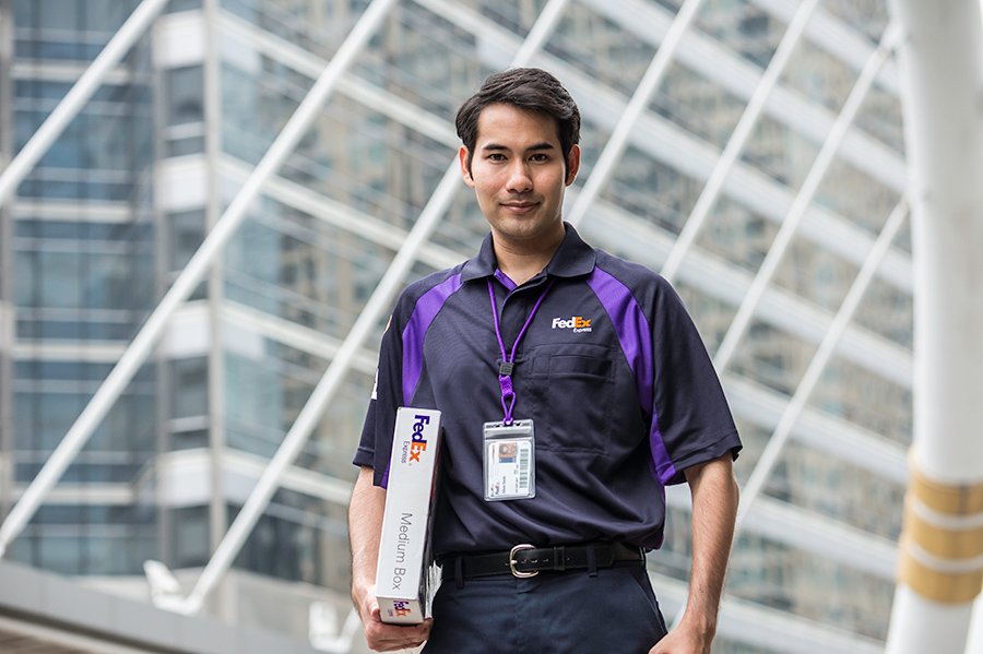 FedEx courier with small boxed package