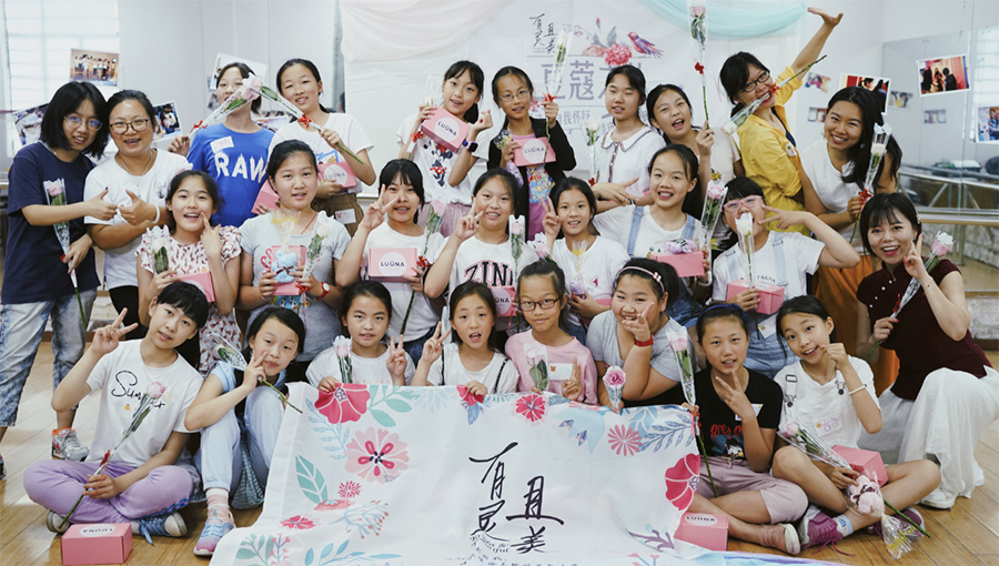 Large group community shot of young Asian girls and women