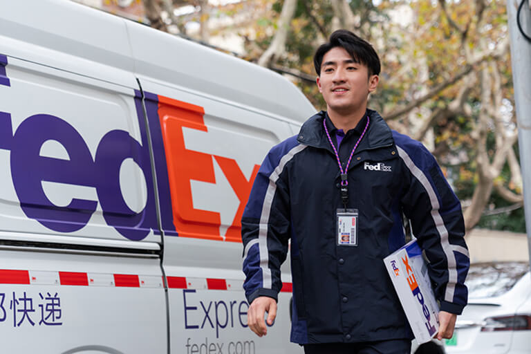 FedEx courier delivering a parcel in China