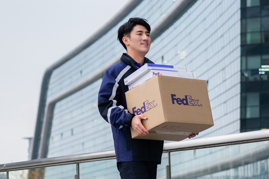 FedEx courier carrying packages in AMEA