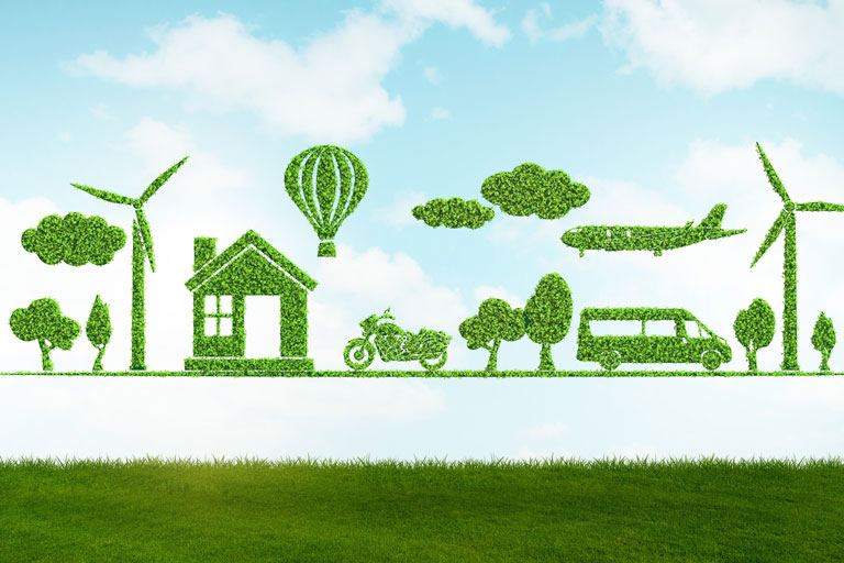 Green-cut-out-trees,-house,-vehicles-and-windmills-on-blue-sky-mobile