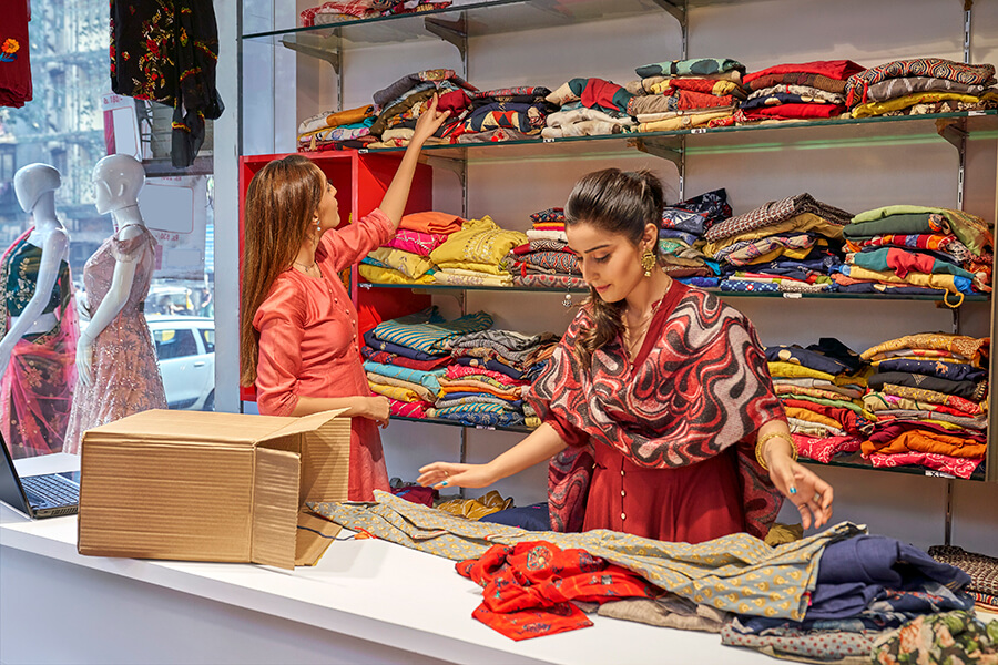 Two females working in a textile store in India