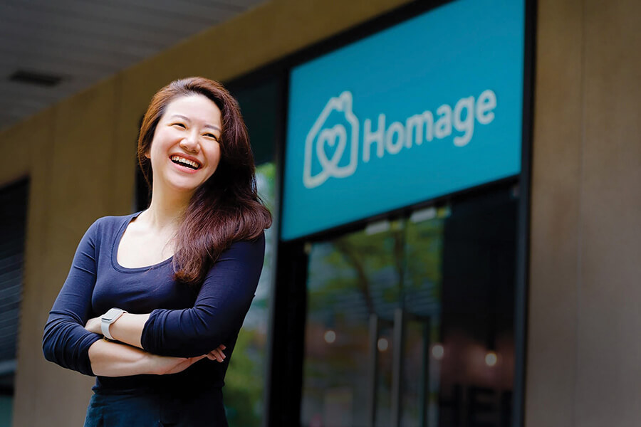 Singaporean female in blue t shirt outside office