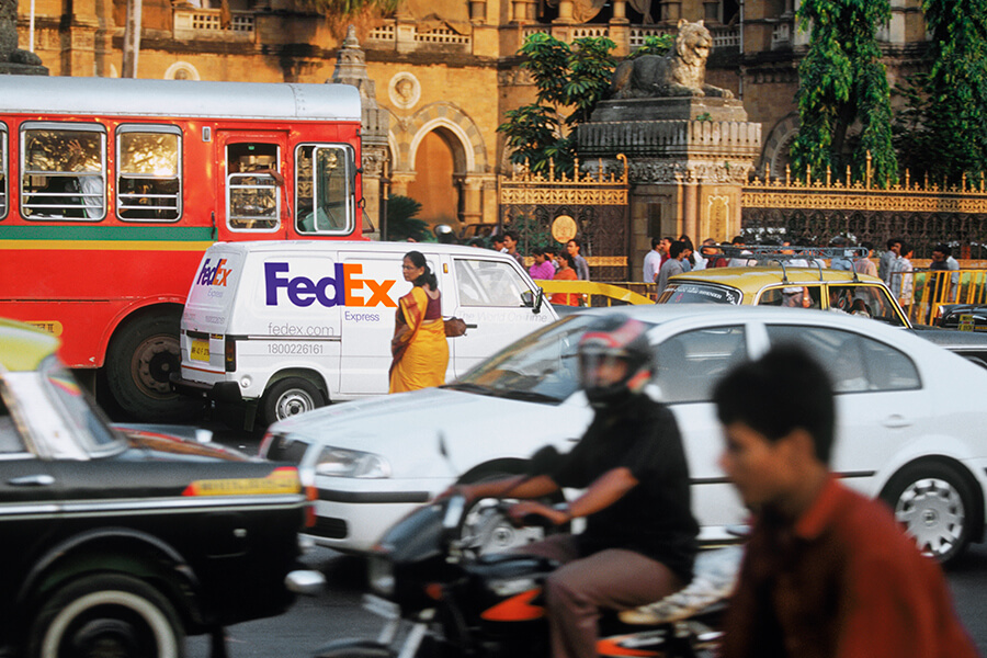 Indian woman in sari crosses street