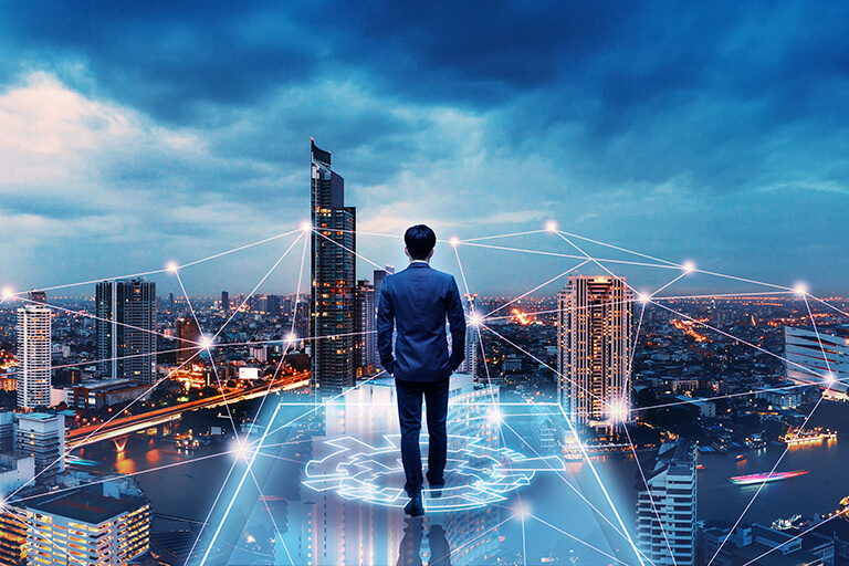 A businessperson is standing in front of the future networking city