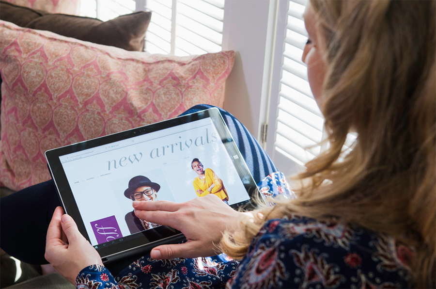 woman browsing online shop via tablet