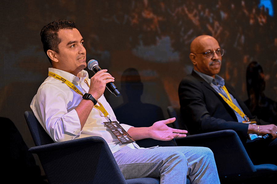 Johary Mustapha speaks at a panel discussion
