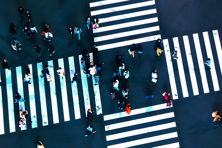 Aerial view of people crossing a big intersection
