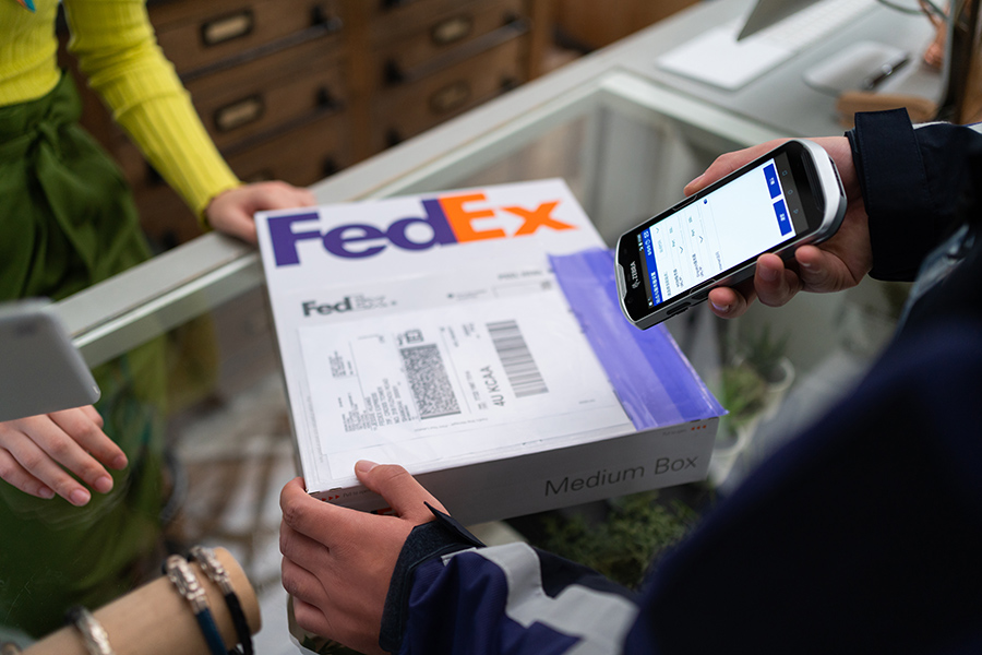 FedEx courier scans package