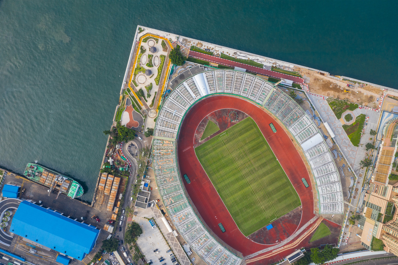 Sports stadium next to a harbor from above