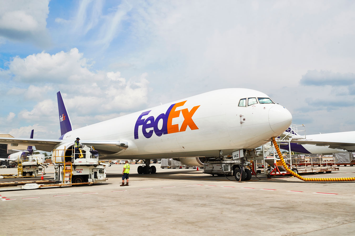 FedEx cargo plane loaded and refueled on airport runway