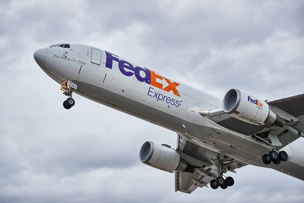 FedEx airplane post-takeoff flying in the sky