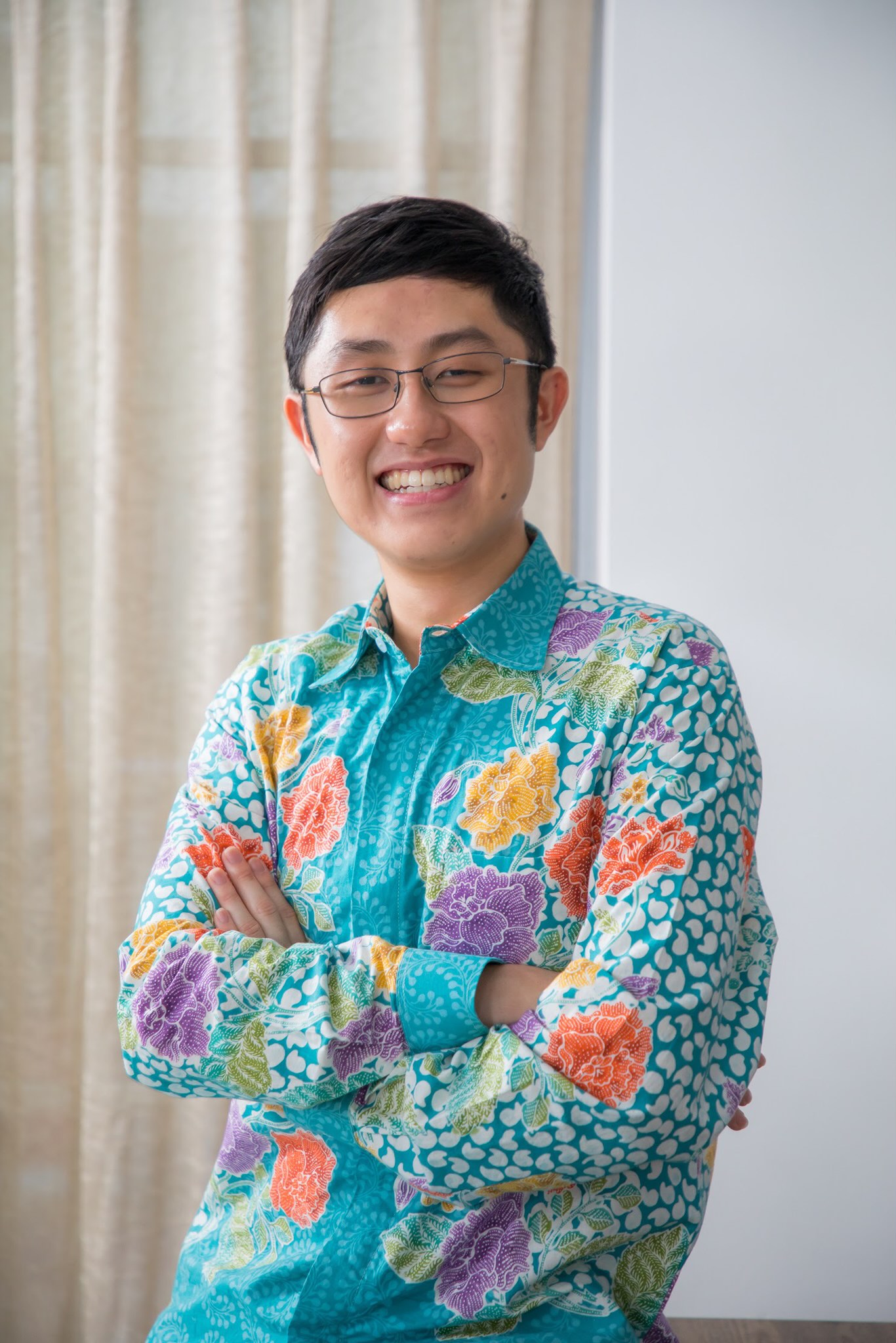 Ian Chew, CEO of Greenie Web in turquoise flowery shirt