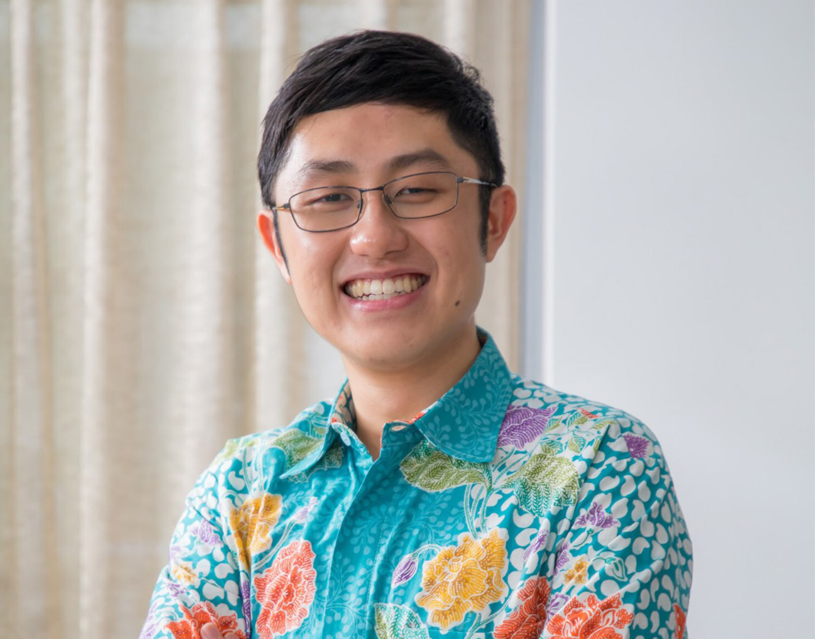 Ian Chew, CEO of Greenie Web in turquoise flowery shirt